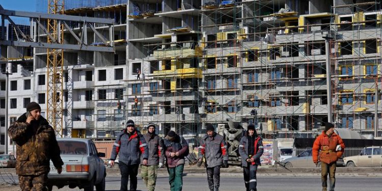 Analysis-Russia’s labour shortage spreads as defence sector poaches staff