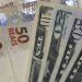 Brazil’s currency weakens, changing course despite aggressive rate strategy