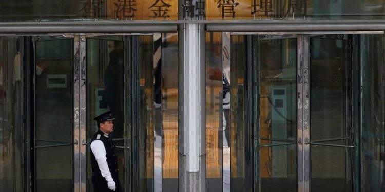 Hong Kong central bank cuts interest rate, tracking Fed move
