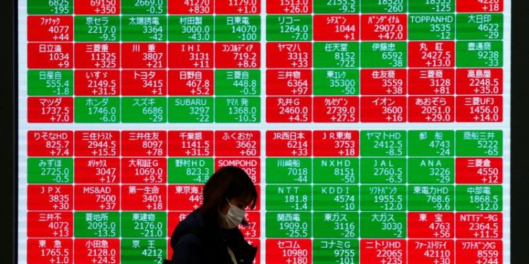 Asian shares pinned near three-month lows, dollar towers at 2-yr peak