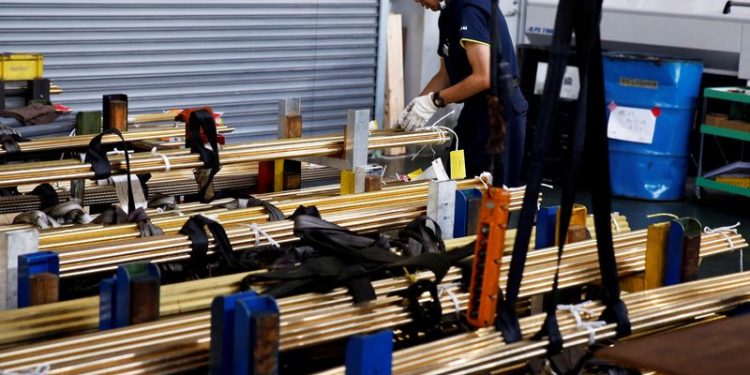 Japan says its economy likely to mark first positive output gap in 7 years