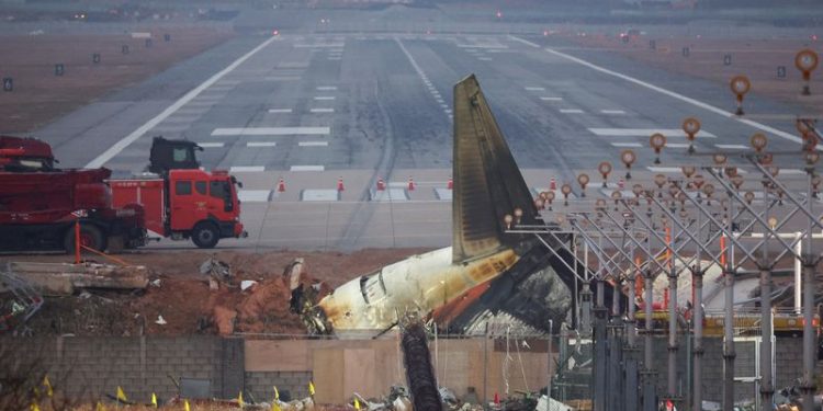 Empty desks and tears mark five colleagues killed in South Korean plane crash