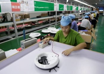 China Nov factory activity expands for second month as Trump threats loom