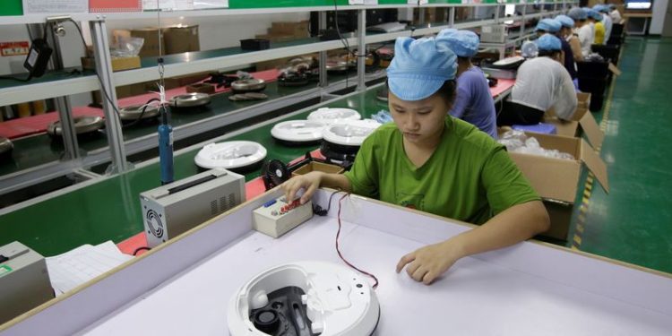 China Nov factory activity expands for second month as Trump threats loom