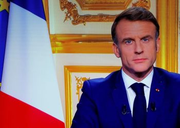 Macron, defying calls to resign, struggles on in search for stable French government