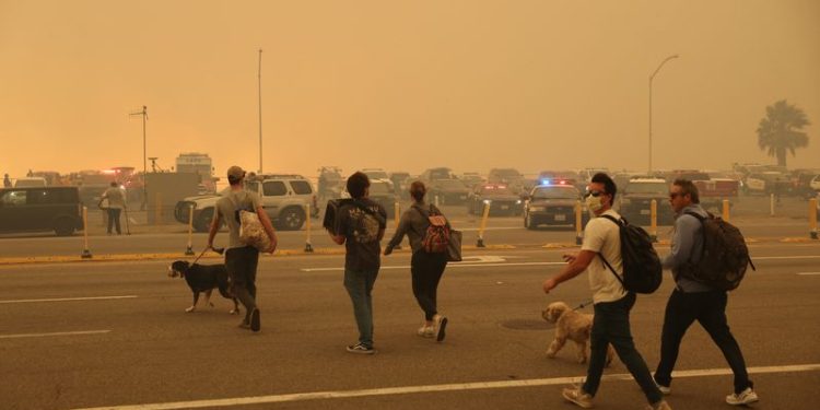 Wildfires rage in Los Angeles, forcing tens of thousands to flee