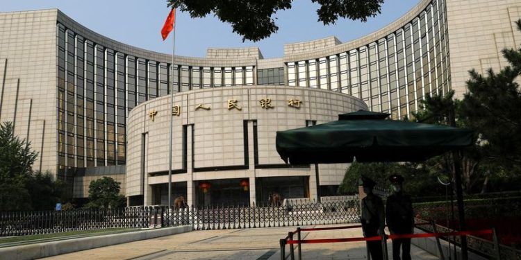 Chinese central banker warns of government bond risks as yields slide