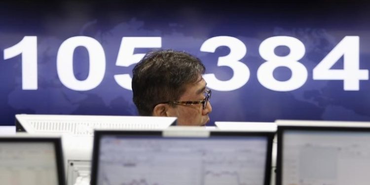 Asia stocks rise on upbeat Chinese data, Japan shares drop amid rate-hike bets