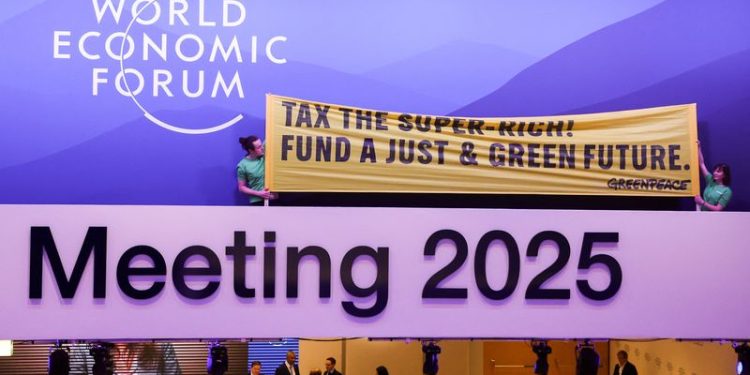 Greenpeace activists stage climate protest inside WEF meeting in Davos