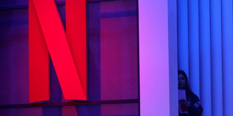 Netflix shares soar on record subscriber gains, planned price hikes