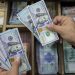 Dollar treads water as Trump tariff clarity, central banks awaited